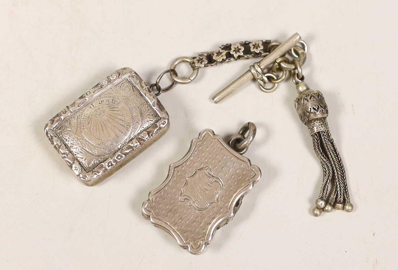 Two small silver vinaigrettes, by Nathaniel Mills, Birmingham, 1843, 23mm and 1831 with tassel fob.